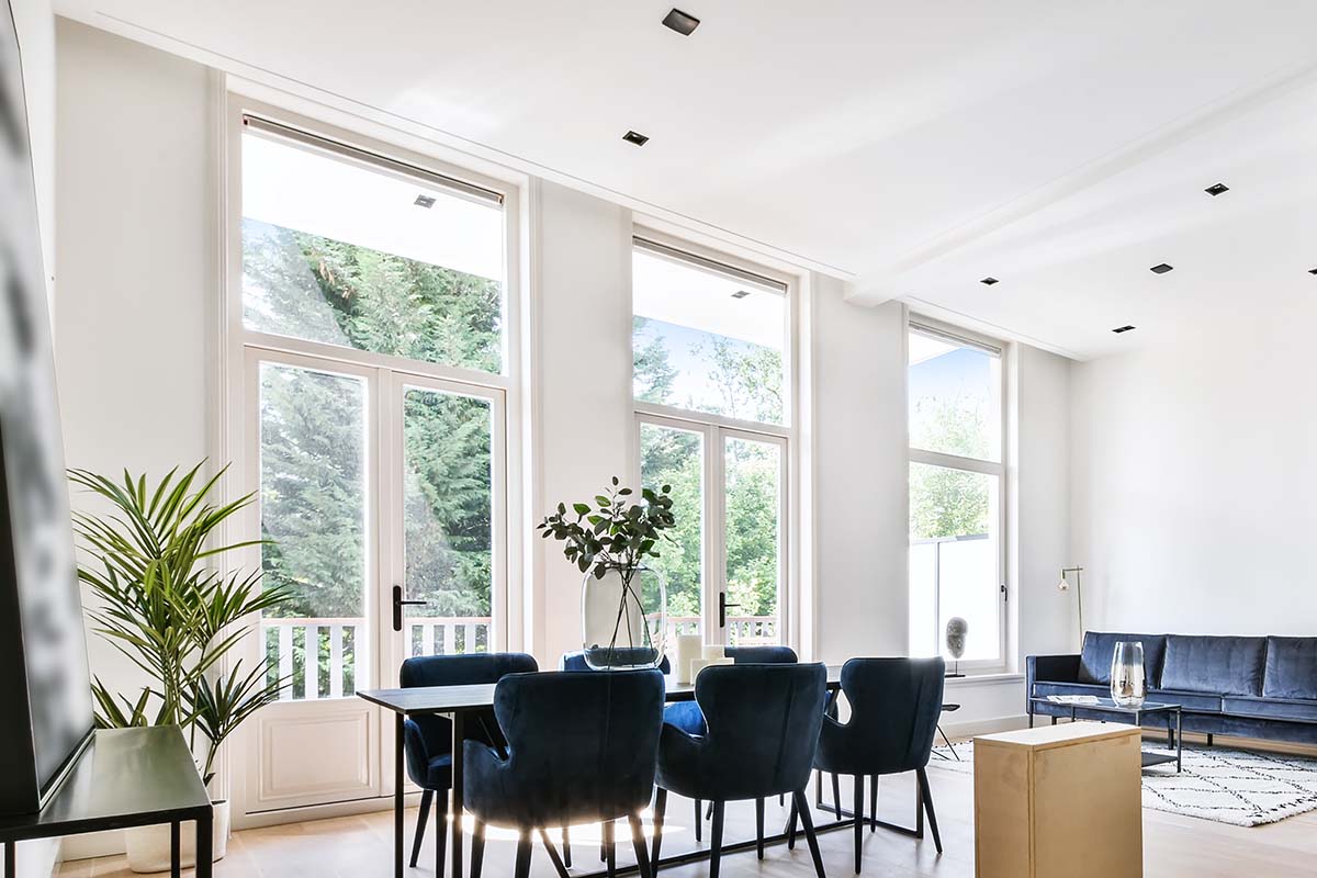 dining room with big windows in a nice home | Bilco Builders, Pensacola, Florida